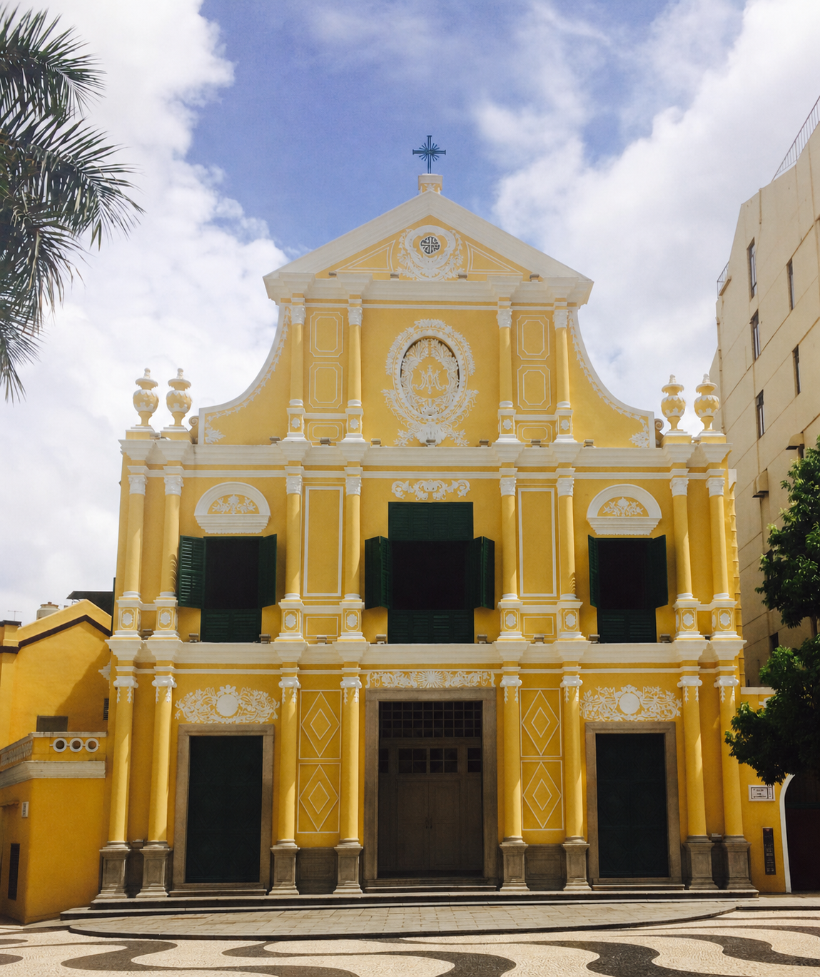 Yellow facade of St. Dominic's Church in Macao beneath a blue sky